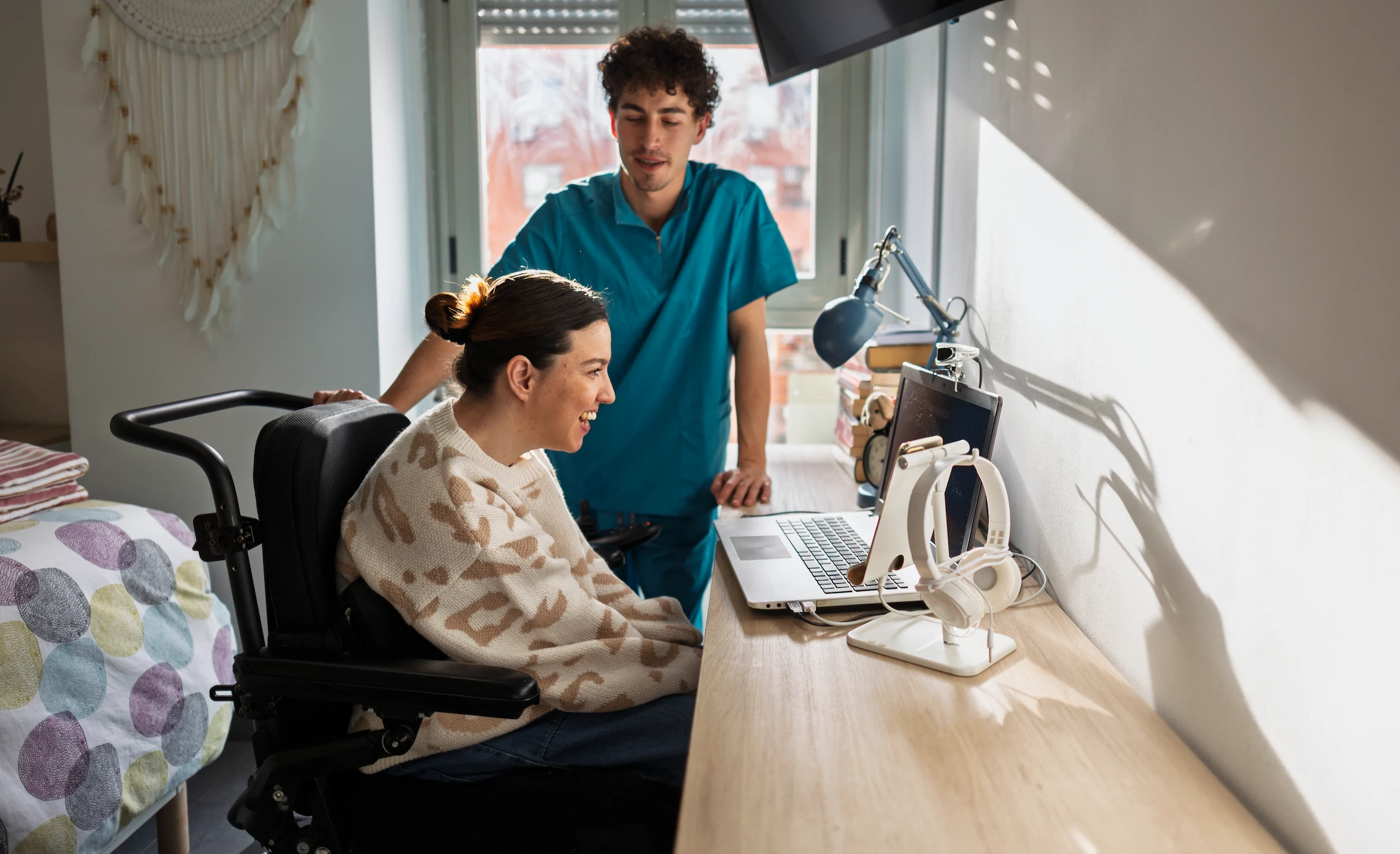 woman-in-wheelchair-working-at-desk-with-assistant-2026-03-06-20-18-58-utc (1)